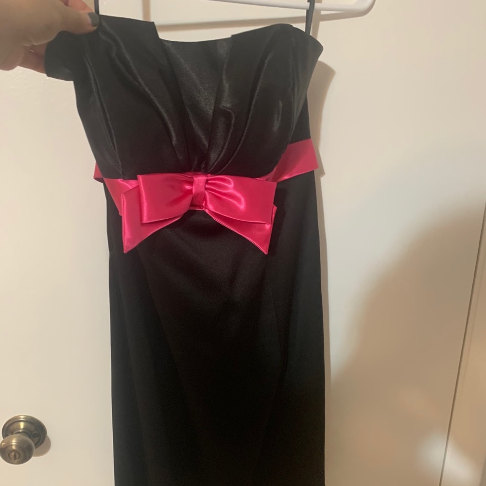 Mini black dress with pink wrap around bow